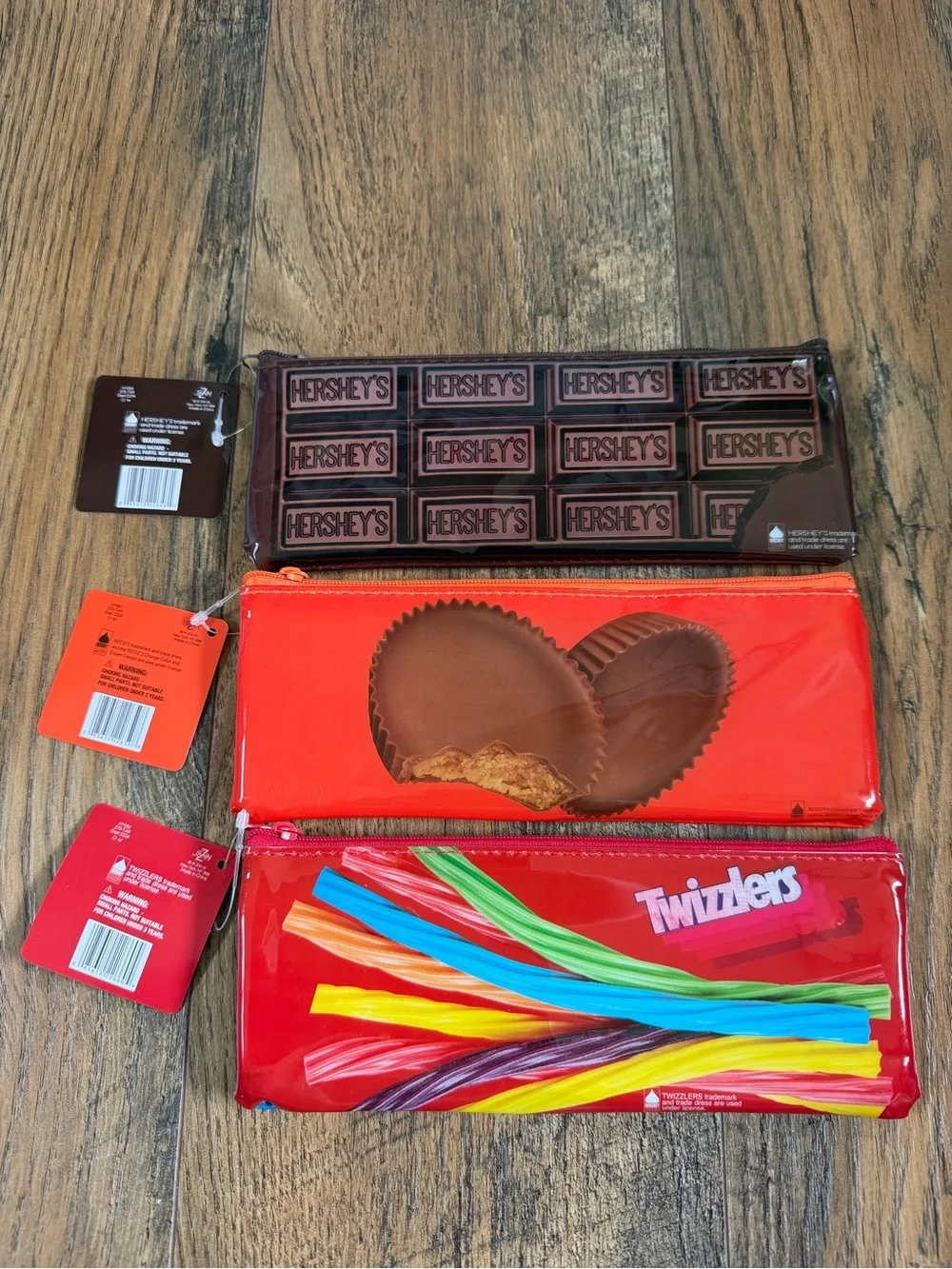 NWT Candy bar logo zipper pouches